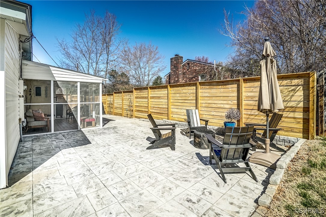 2124 Tarleton Drive Charlottesville, VA 22901 - Photo 40 of 45 a view of a patio with a table chairs and wooden fence