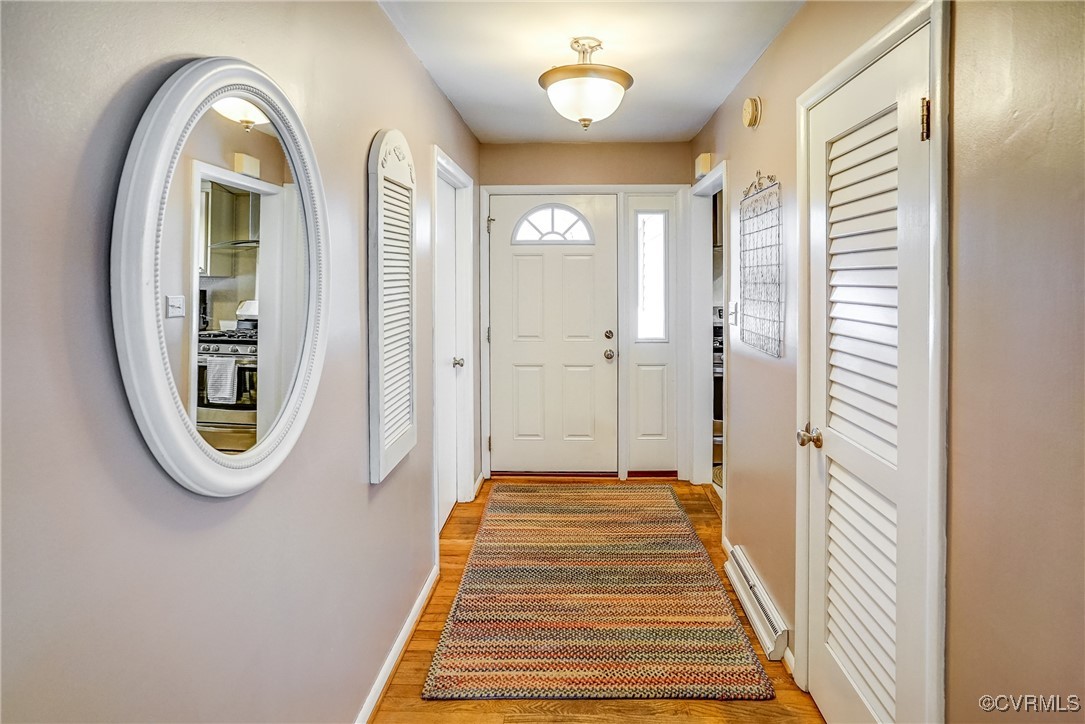 2124 Tarleton Drive Charlottesville, VA 22901 - Photo 4 of 45 a view of a hallway with entryway wooden floor and a chandelier