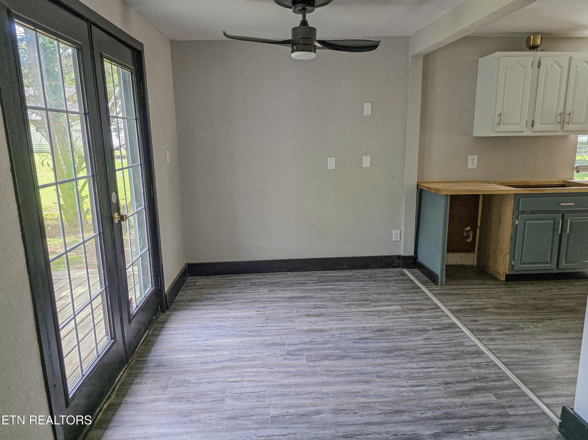218 Burns Street Alcoa, TN 37701 - Photo 20 of 27 a view of an empty room with a window and wooden floor
