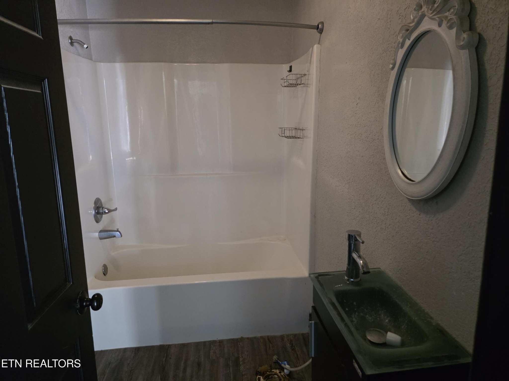 218 Burns Street Alcoa, TN 37701 - Photo 2 of 27 a bathroom with a sink and a mirror