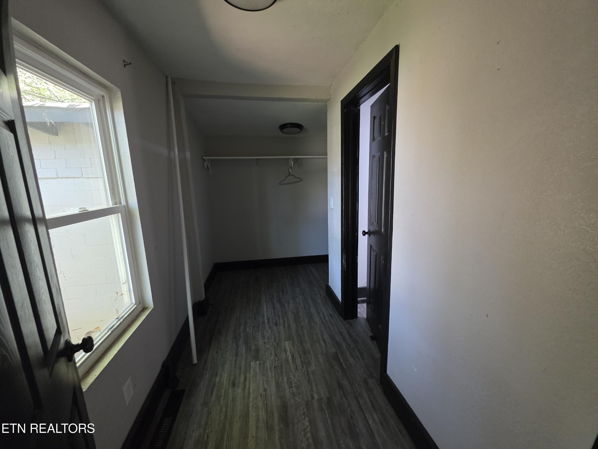218 Burns Street Alcoa, TN 37701 - Photo 6 of 27 a view of a hallway with wooden floor and stairs