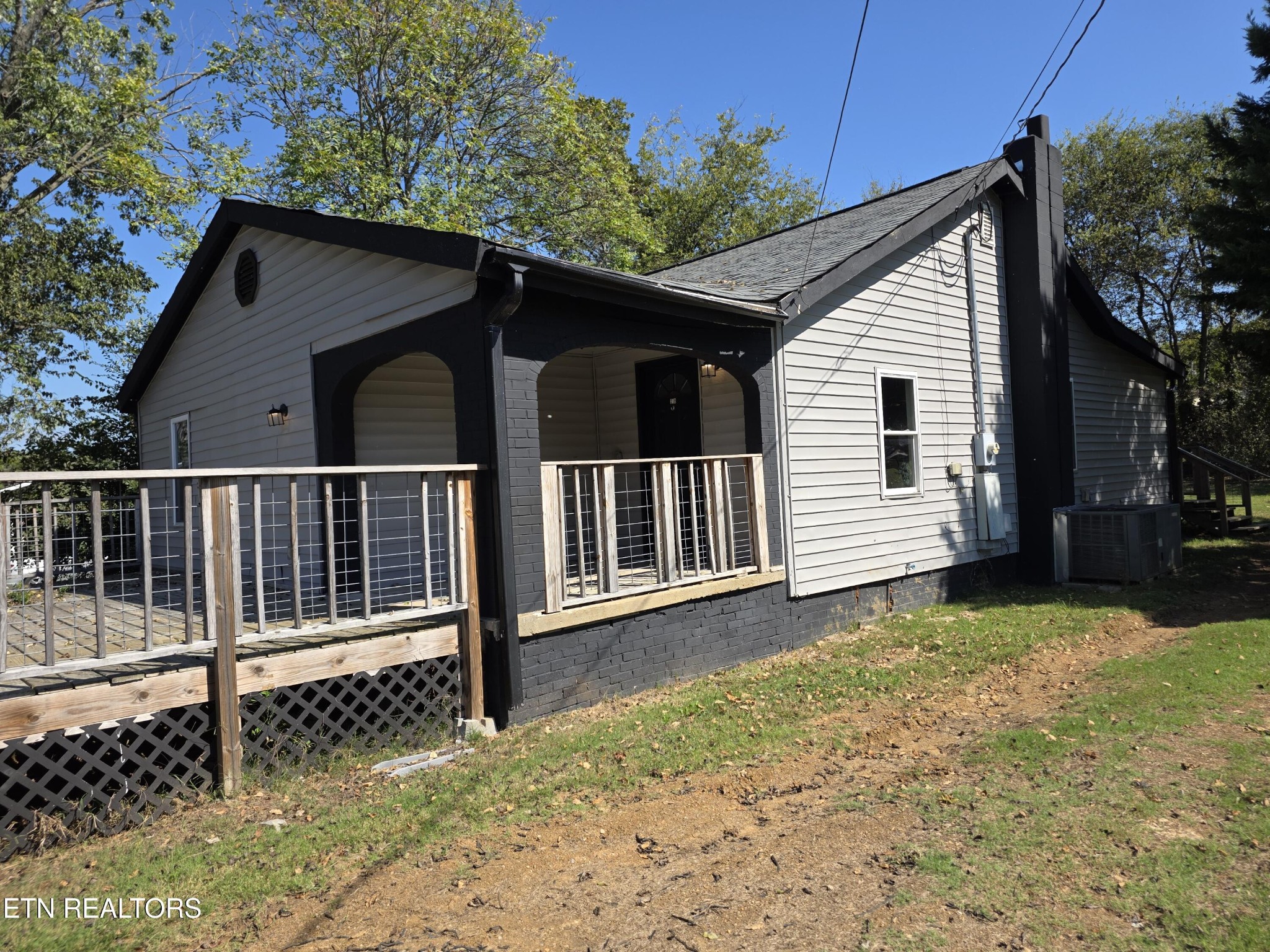 218 Burns Street Alcoa, TN 37701 - Photo 8 of 27 a view of a house with a yard and floor to ceiling window