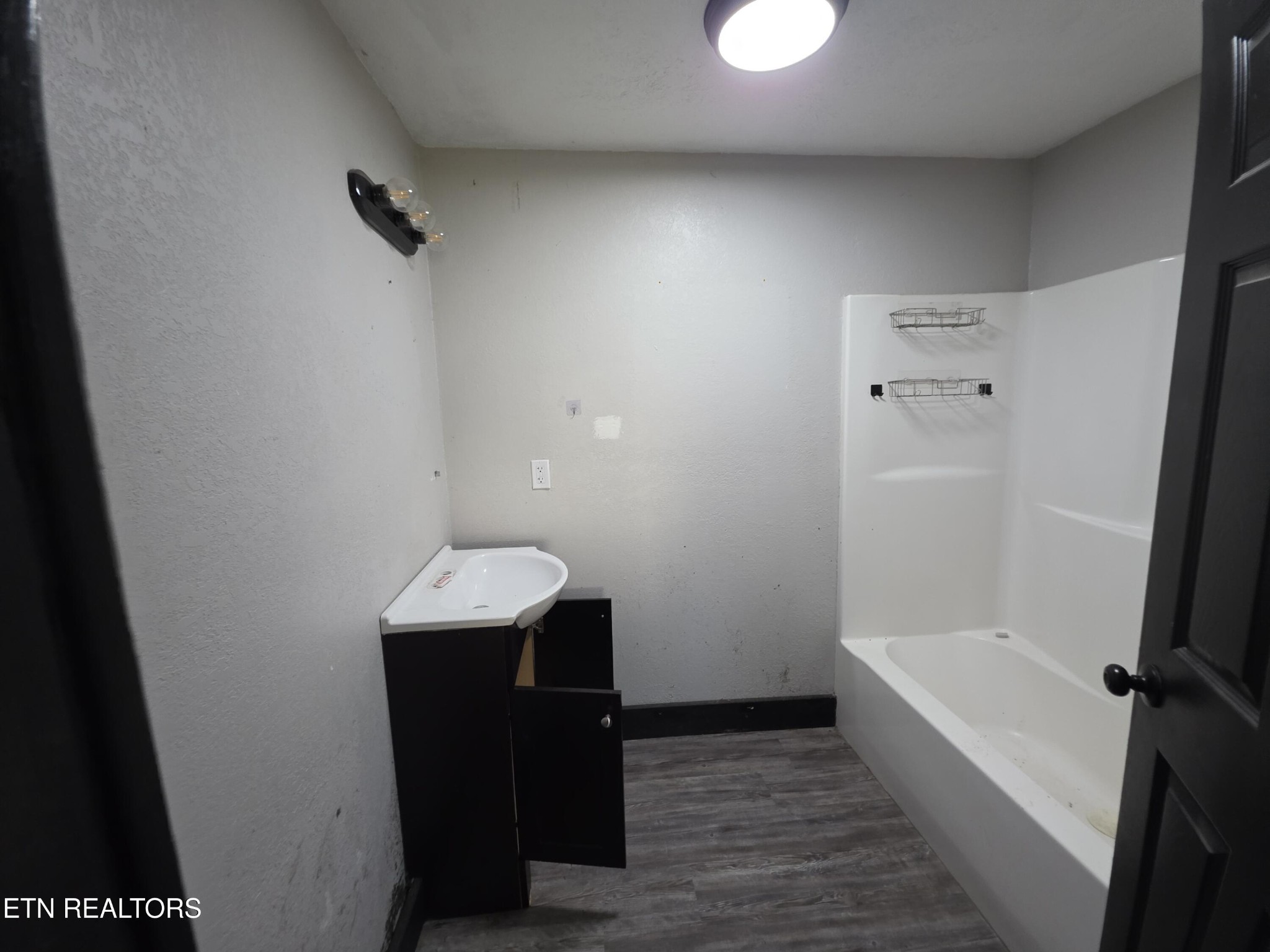 218 Burns Street Alcoa, TN 37701 - Photo 10 of 27 a bathroom with a sink and a mirror