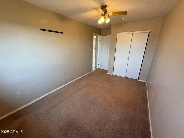 a view of a big room with carpet