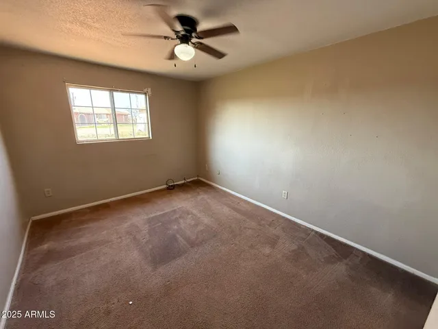 a view of a big room with carpet