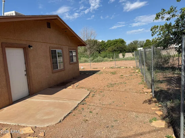 a backyard of a house with lots of green space