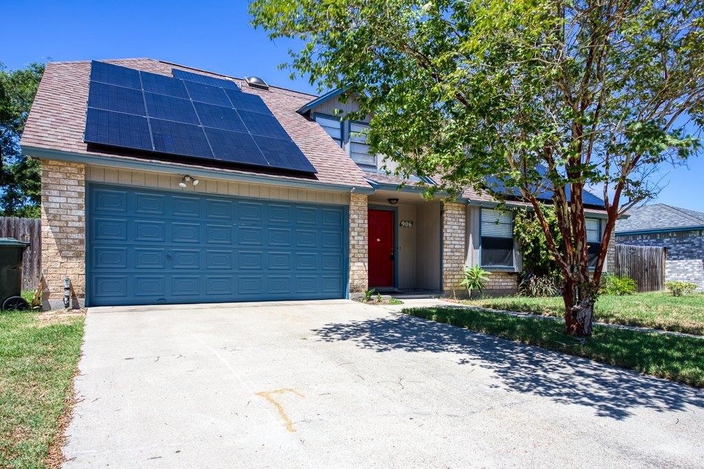 906 St Christopher Street Corpus Christi, TX 78418 - Photo 1 of 40 a front view of a house with a yard