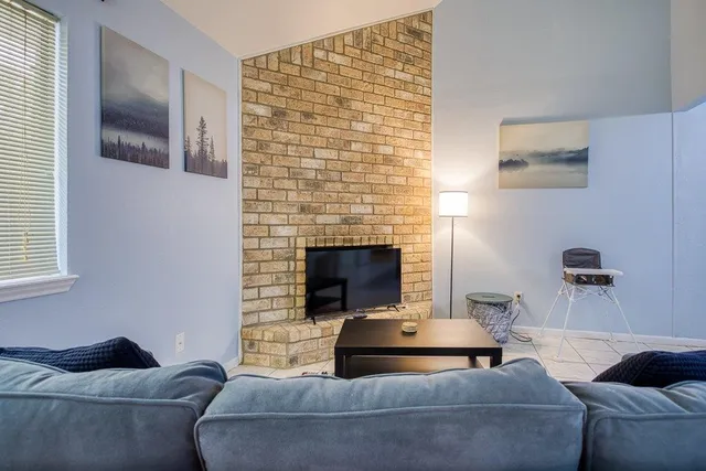 a room that has a bed and a chair in it