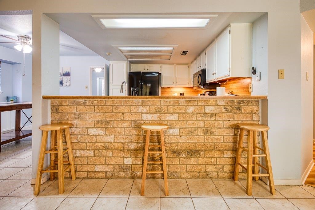 906 St Christopher Street Corpus Christi, TX 78418 - Photo 20 of 40 a bathroom with a sink and a mirror