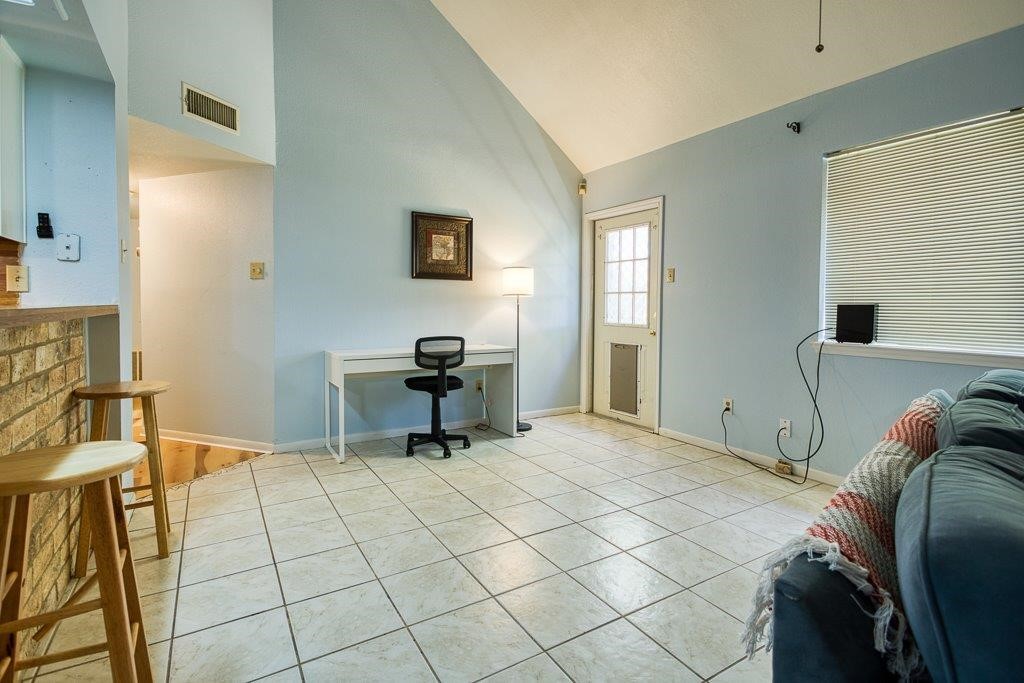 906 St Christopher Street Corpus Christi, TX 78418 - Photo 21 of 40 a room that has a bed and a chair in it