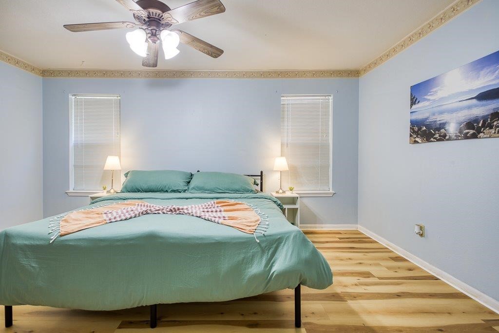 906 St Christopher Street Corpus Christi, TX 78418 - Photo 22 of 40 a bedroom with a bed and window