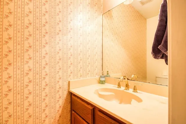 a view of a patio with a table chairs and backyard