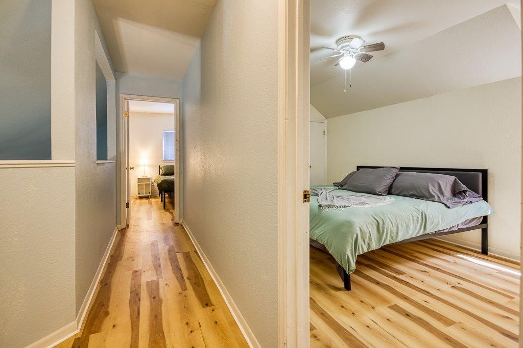 906 St Christopher Street Corpus Christi, TX 78418 - Photo 29 of 40 a bedroom with a bed and wooden floor