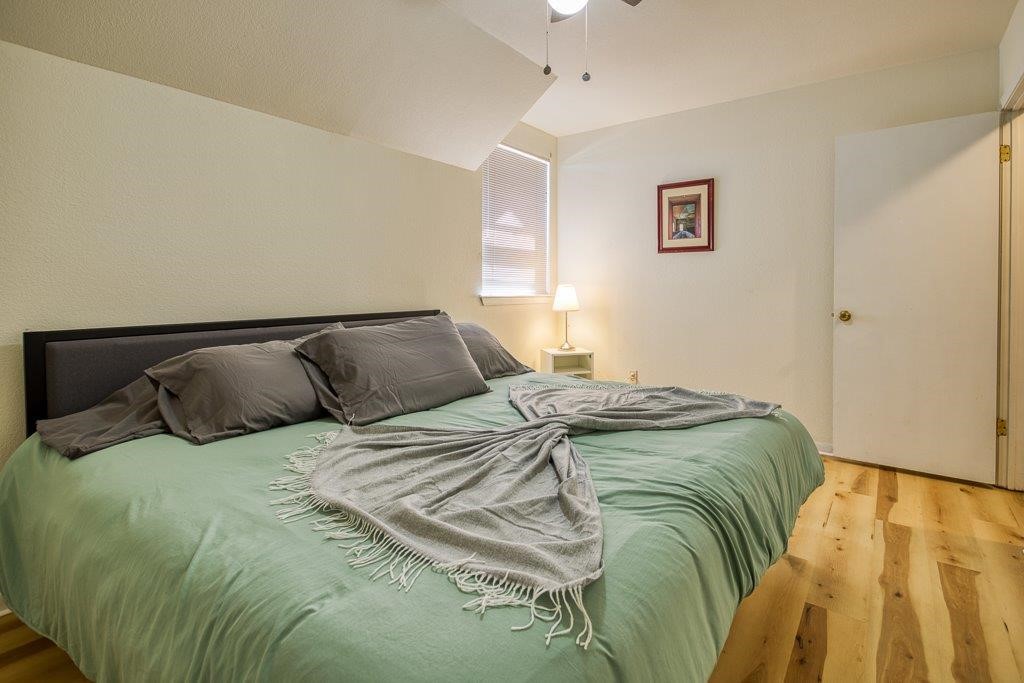 906 St Christopher Street Corpus Christi, TX 78418 - Photo 31 of 40 a bed sitting in a bedroom next to a window