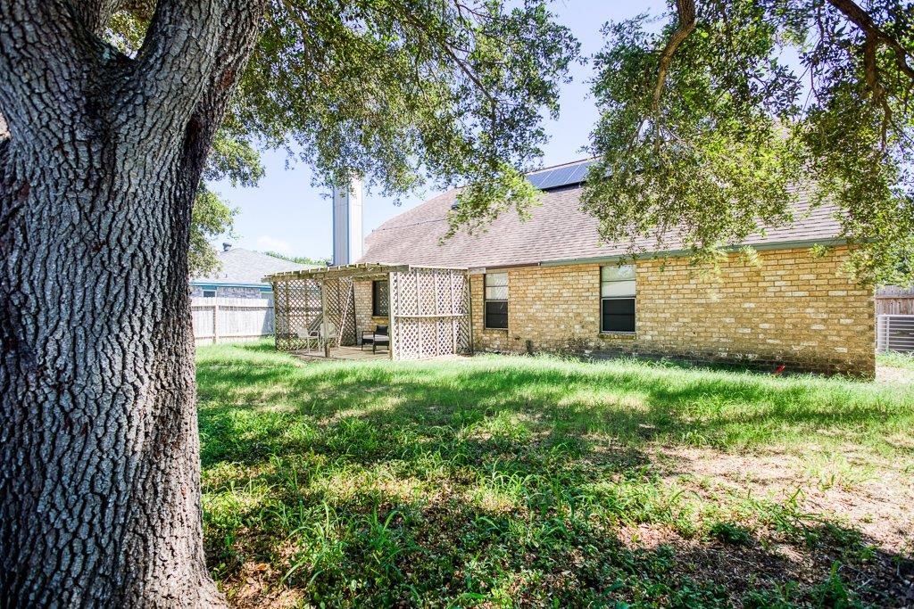 906 St Christopher Street Corpus Christi, TX 78418 - Photo 40 of 40 a view of a house with a backyard