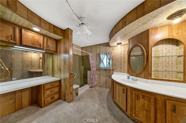 a bathroom with a double vanity sink and a mirror