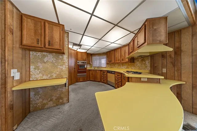 a view of a kitchen with furniture and a kitchen