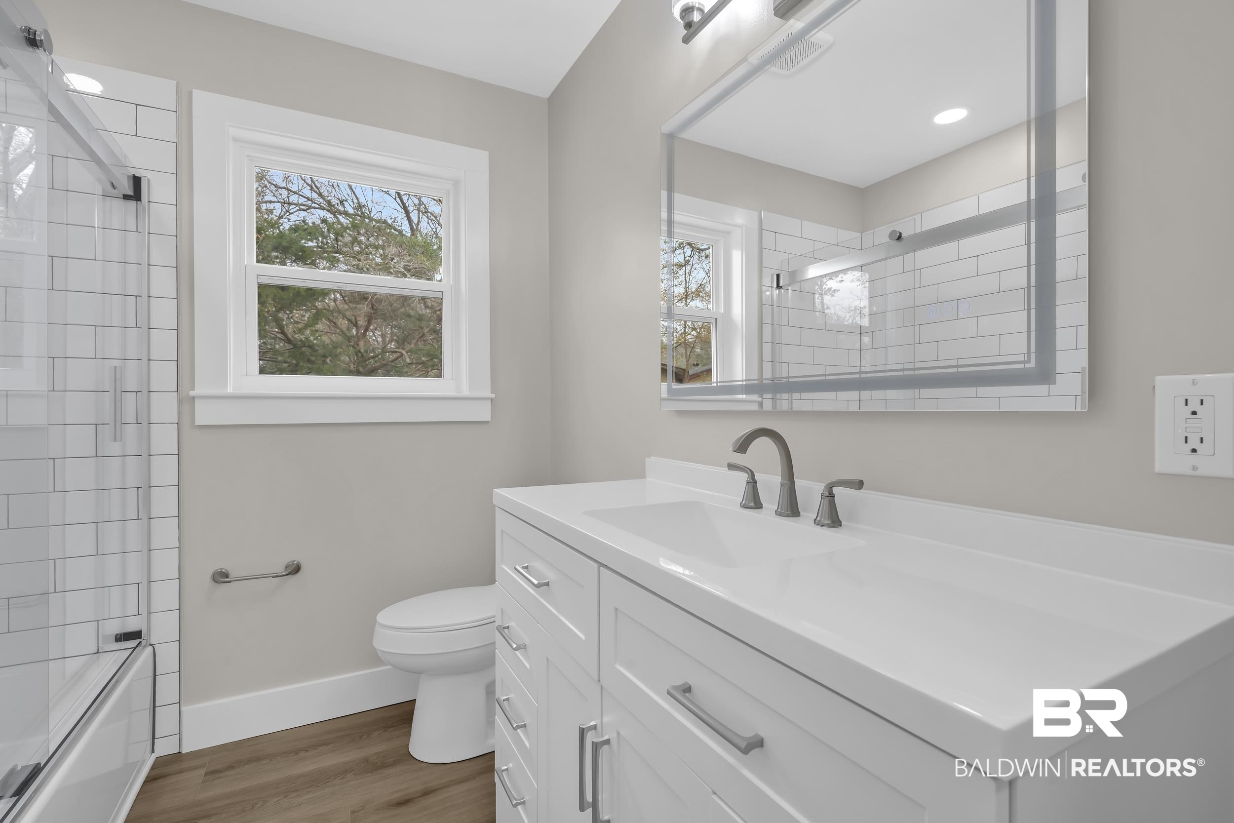 11381 Normandy Drive East Semmes, AL 36575 - Photo 16 of 23 Full bath featuring vanity, light wood finished floors, and bathing tub / shower combination