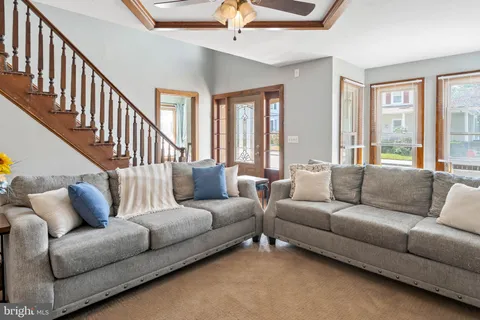 a living room with furniture or couches and a dining table