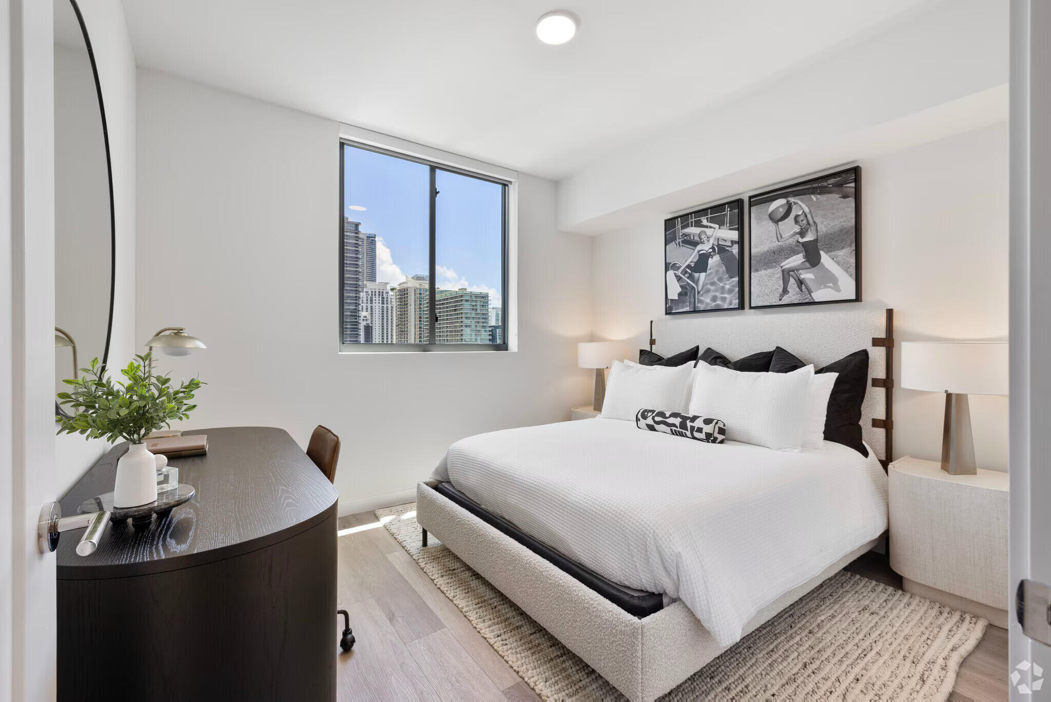 201 Southwest 10th Street, Unit 2201 Miami, FL 33130 - Photo 16 of 17 a bedroom with a bed and a potted plant