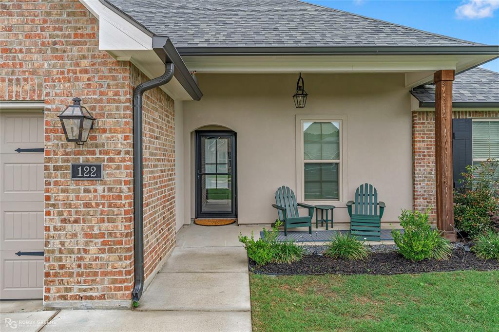 122 Brimestone Loop Benton, LA 71006 - Photo 3 of 33 a front view of a house with garden