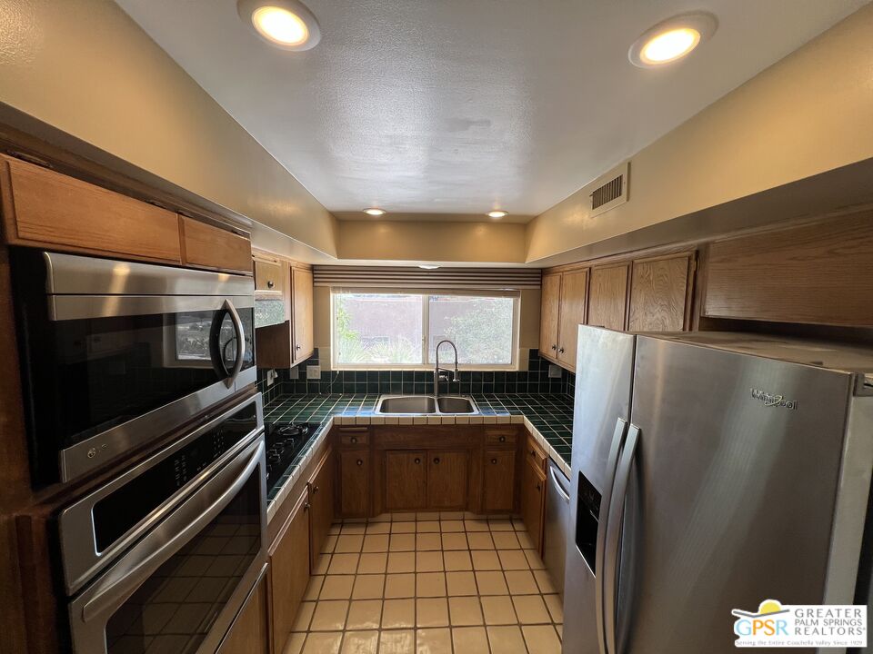 Undisclosed Address Yucca Valley, CA 92284 - Photo 21 of 46 a kitchen with a refrigerator and a sink
