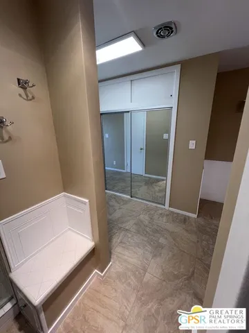 a bathroom with a sink a mirror and shower
