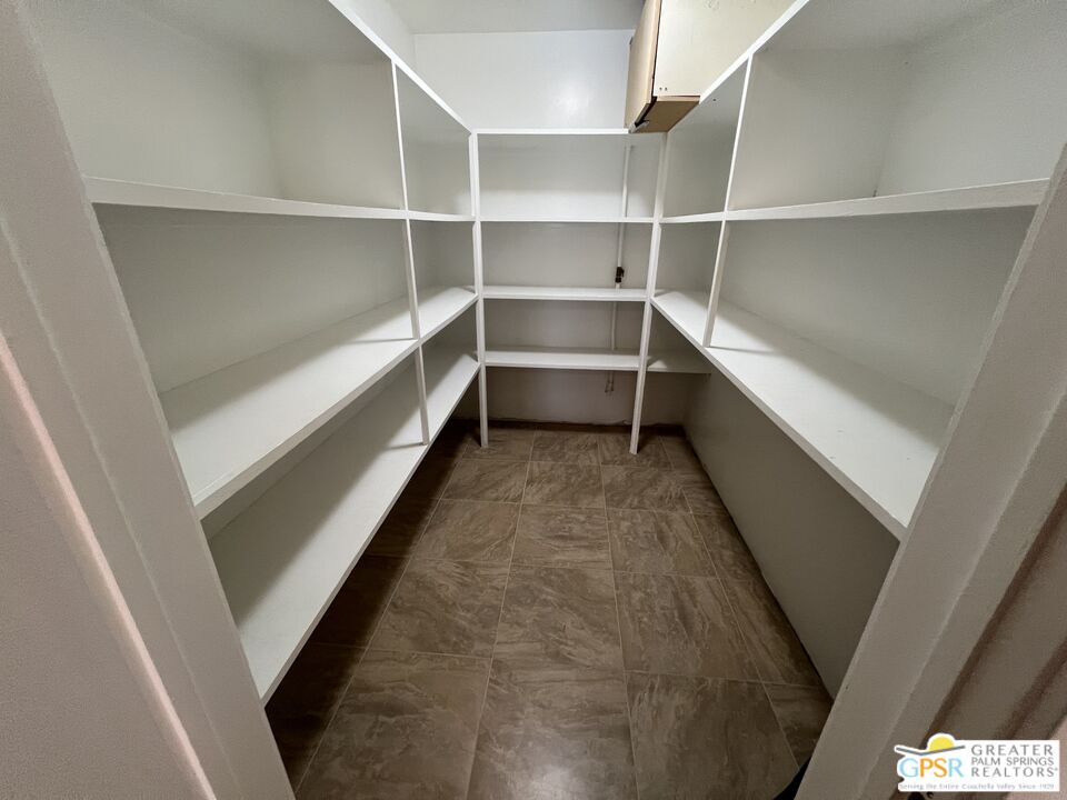 Undisclosed Address Yucca Valley, CA 92284 - Photo 28 of 46 a storage room with empty racks