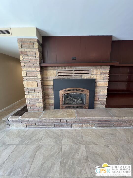 Undisclosed Address Yucca Valley, CA 92284 - Photo 5 of 46 a fireplace with a clock on top of it