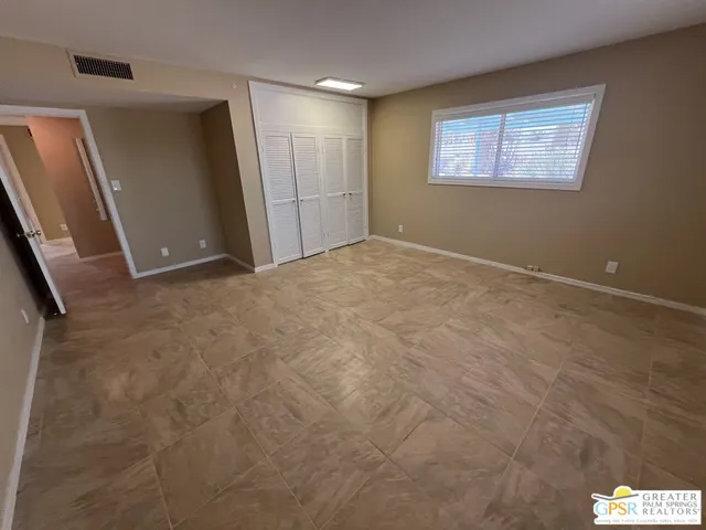 a view of an empty room and window