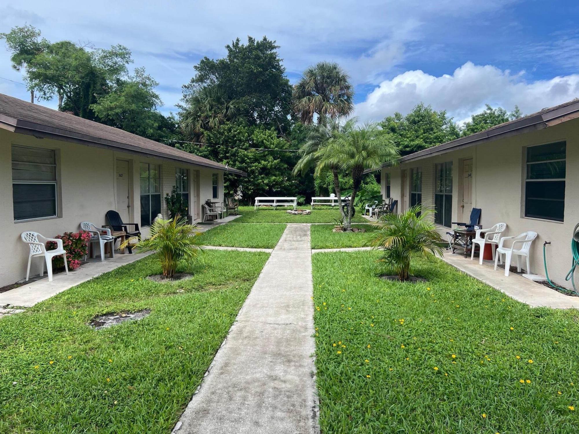 2621 Southeast Clayton Street Stuart, FL 34997 - Photo 2 of 40 a view of a backyard with a garden and plants