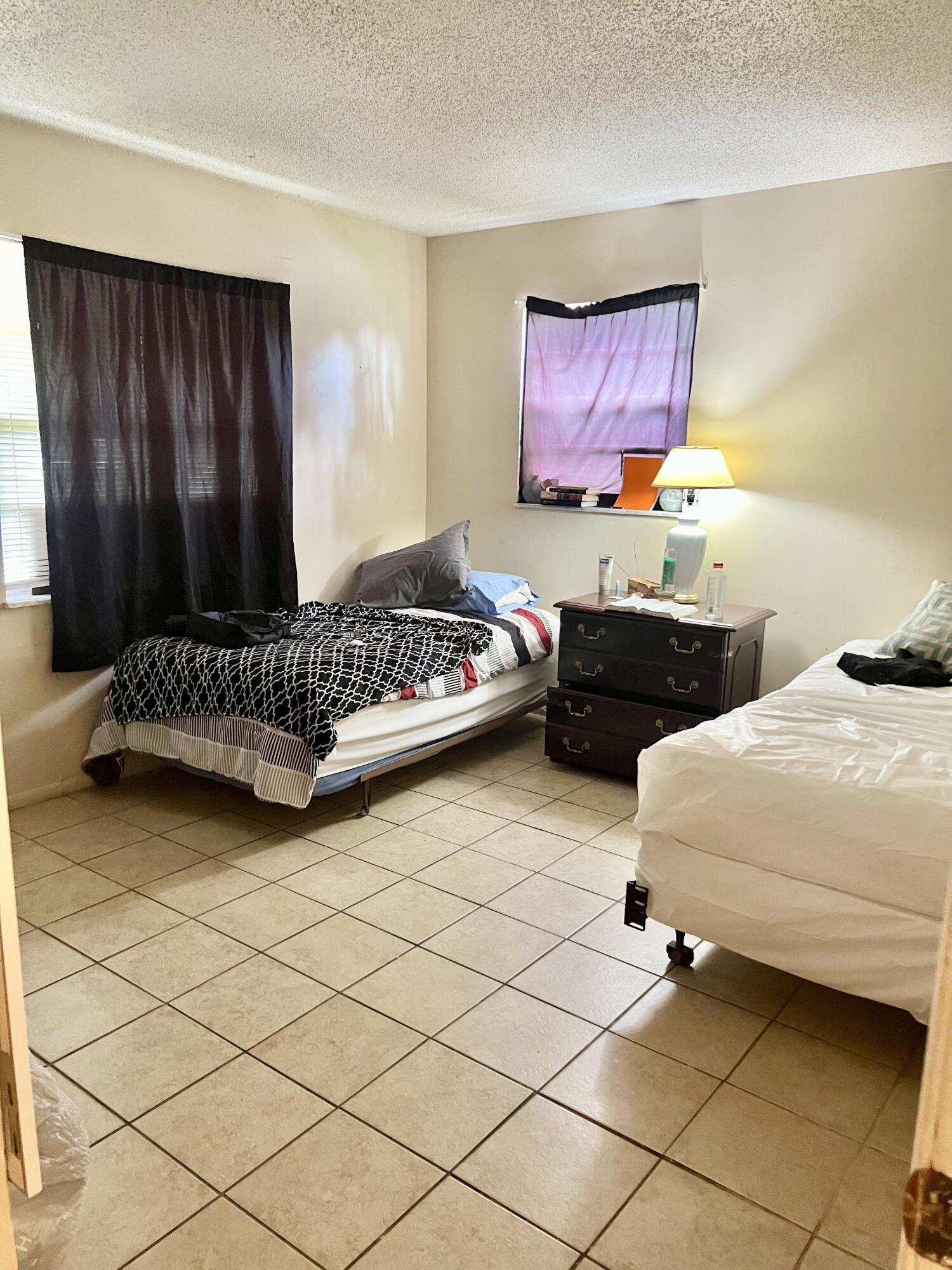 2621 Southeast Clayton Street Stuart, FL 34997 - Photo 23 of 40 a bedroom with a bed and window