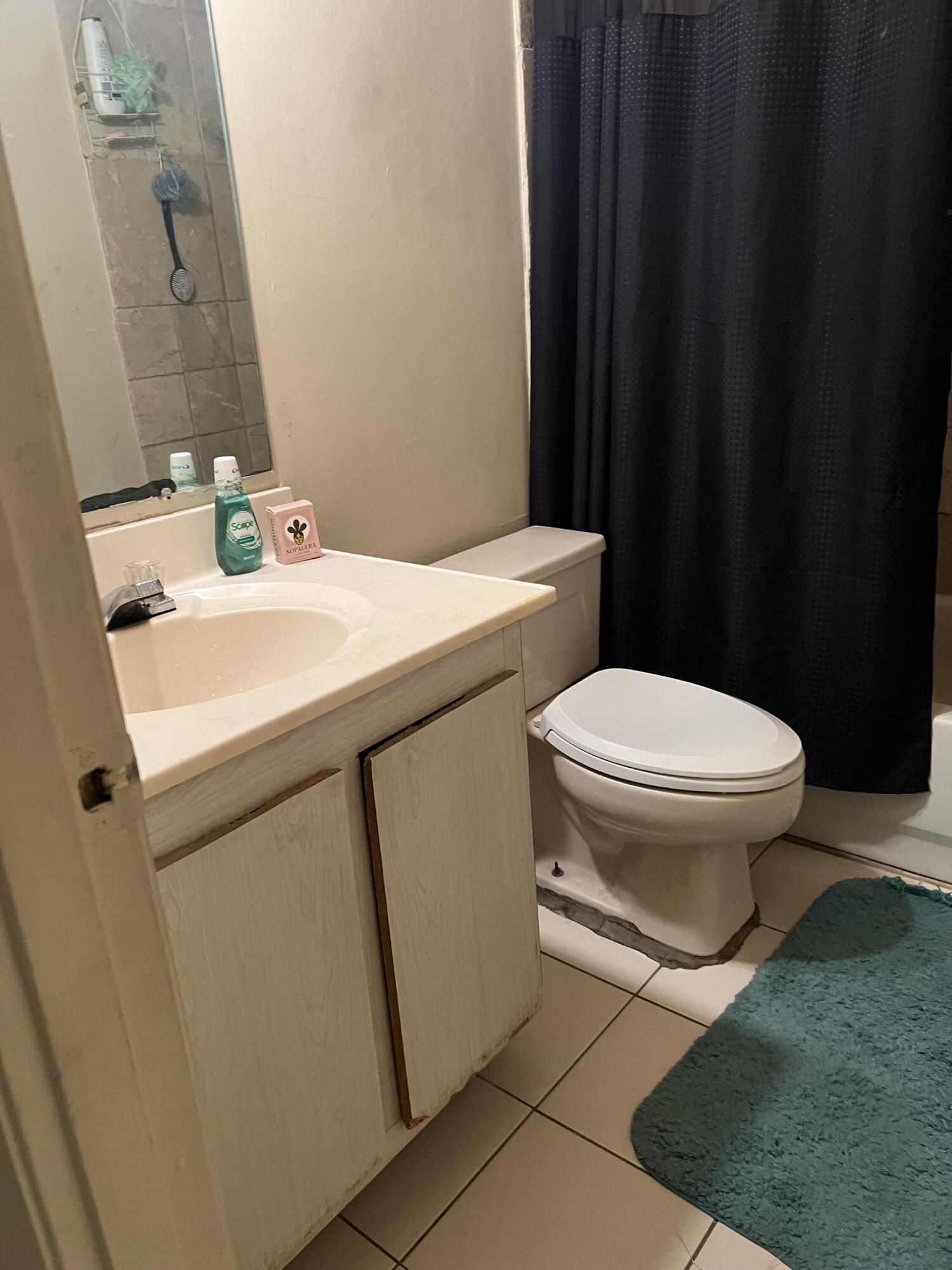 2621 Southeast Clayton Street Stuart, FL 34997 - Photo 37 of 40 a bathroom with a sink and a toilet