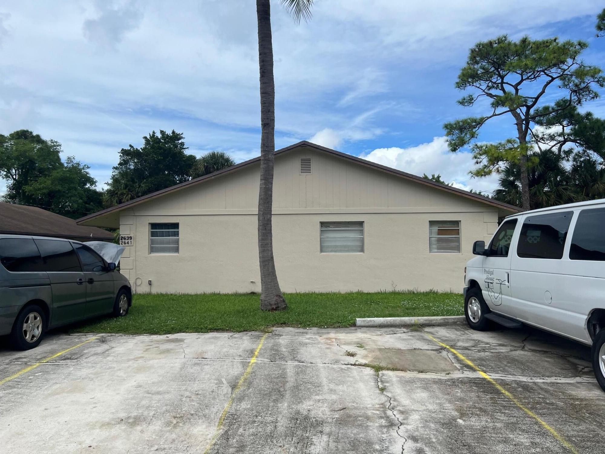 2621 Southeast Clayton Street Stuart, FL 34997 - Photo 6 of 40 a view of a car parked in front of a house