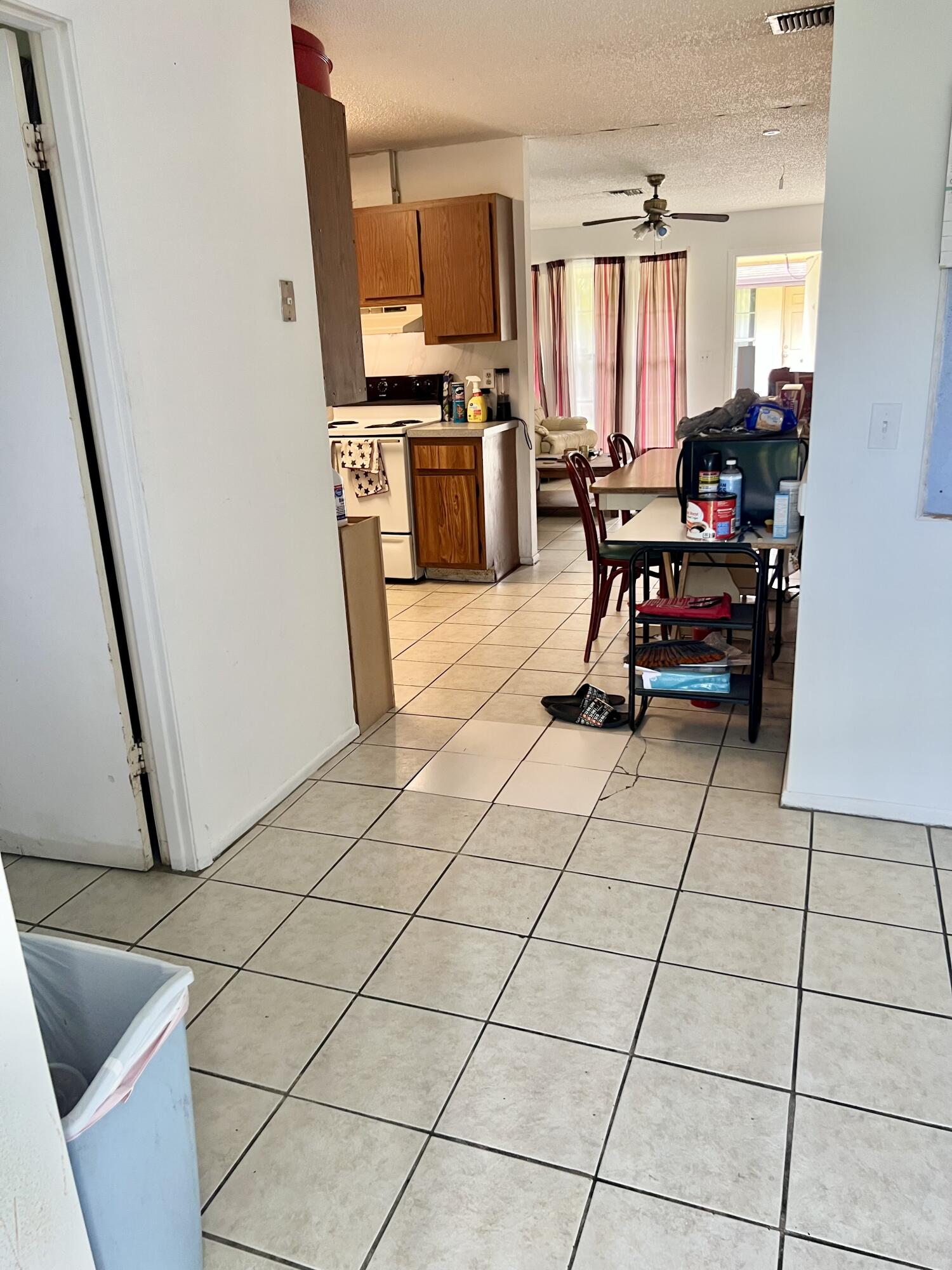 2621 Southeast Clayton Street Stuart, FL 34997 - Photo 10 of 40 a living room with furniture a flat screen tv and outdoor view