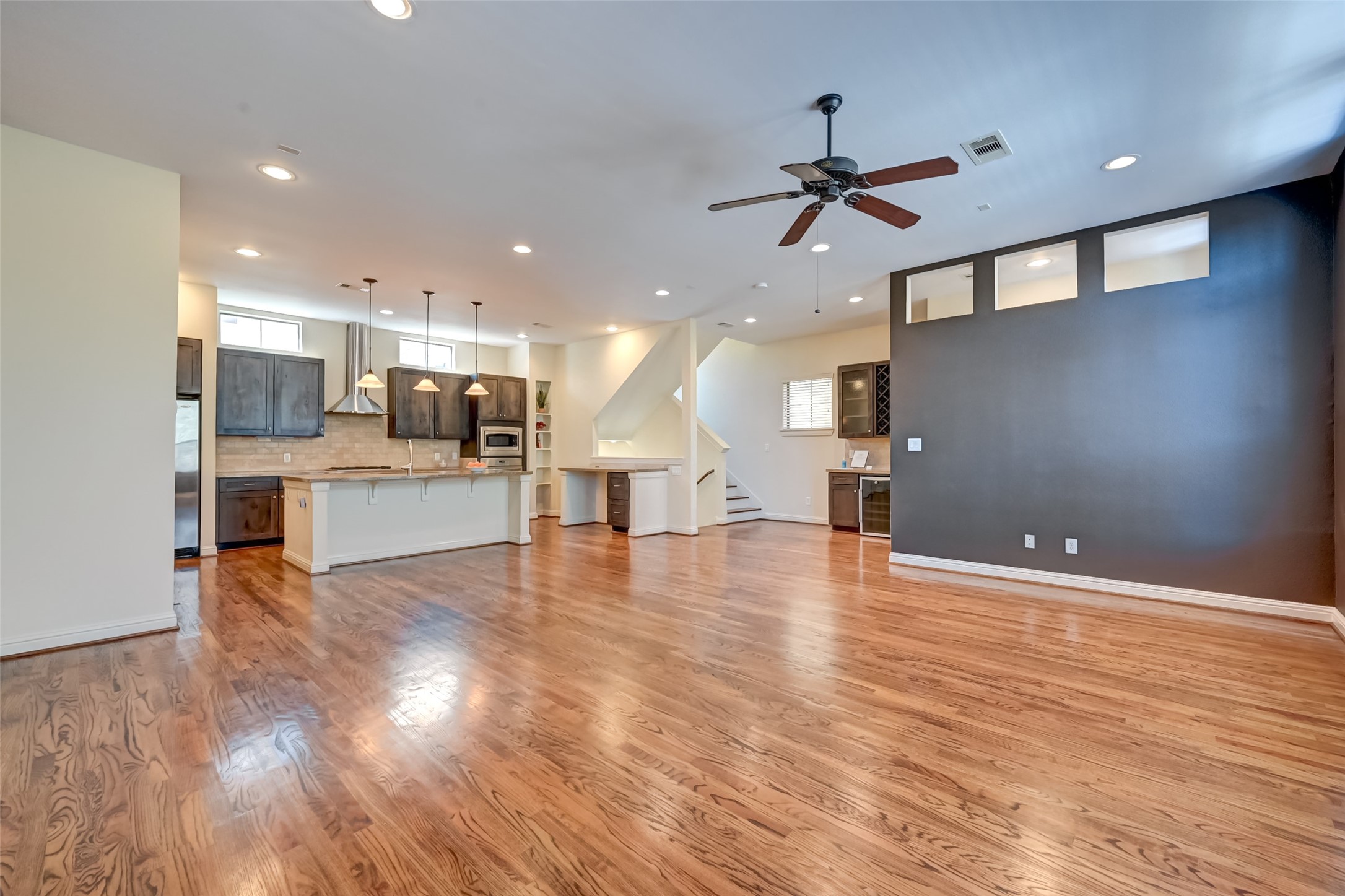 5211 Eigel Street, Unit C Houston, TX 77007 - Photo 14 of 35 View of dining/living area and Kitchen Area with gorgeous wood floor and natural light.