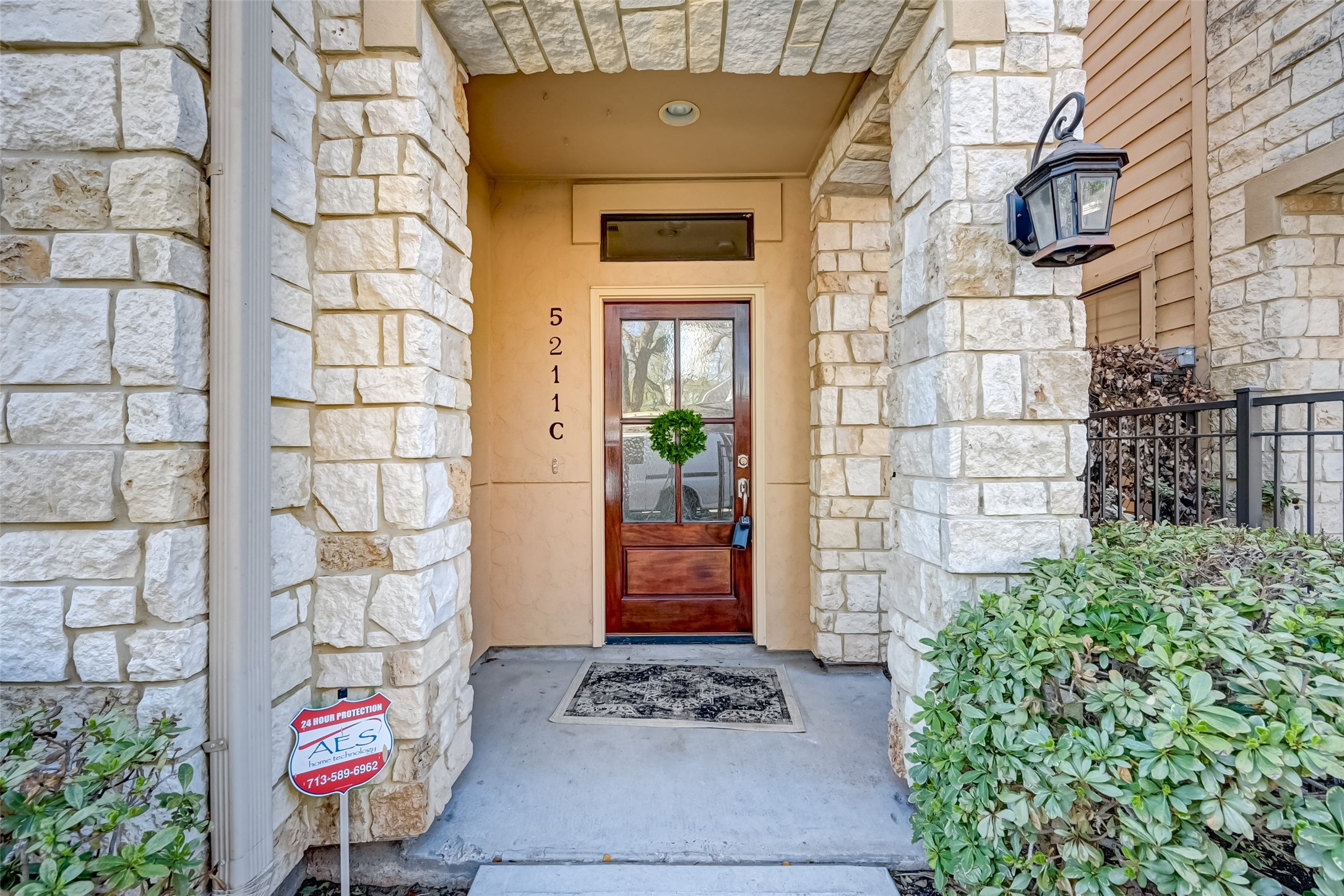 5211 Eigel Street, Unit C Houston, TX 77007 - Photo 3 of 35 Front door is a beautiful dark wood with 4 distorted glass windows.