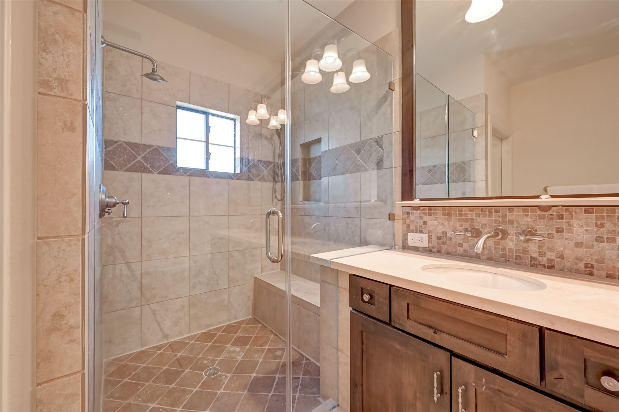 5211 Eigel Street, Unit C Houston, TX 77007 - Photo 32 of 35 Primary bath also features a stainless shower with tile accents and 2 separate shower heads