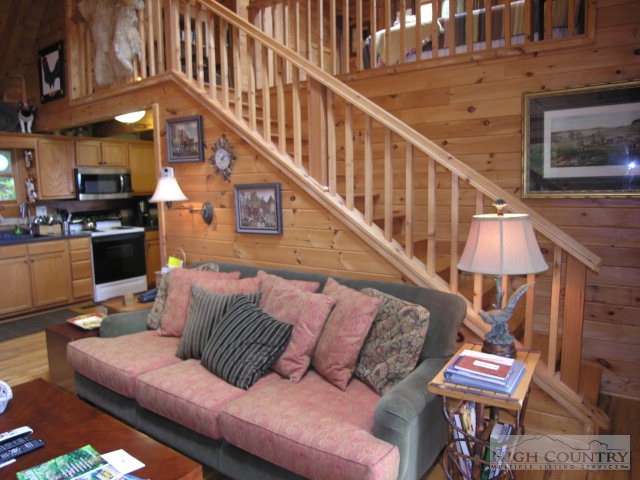 236 Frog Hollar Road Deep Gap, NC 28618 - Photo 14 of 23 a living room with furniture and a dining table