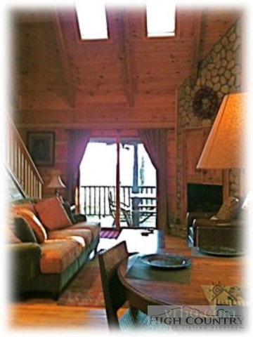 236 Frog Hollar Road Deep Gap, NC 28618 - Photo 21 of 23 a living room with furniture and a fireplace