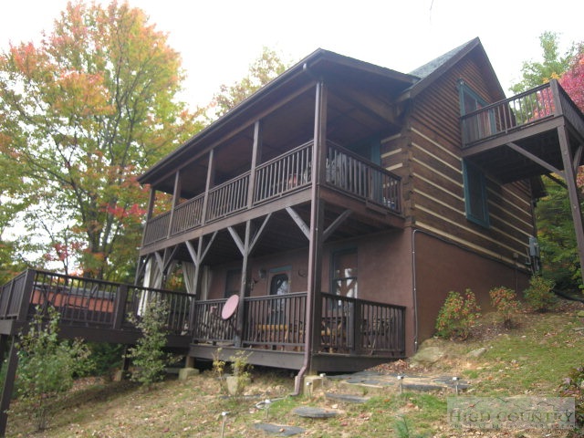 236 Frog Hollar Road Deep Gap, NC 28618 - Photo 3 of 23 a view of a house with a yard