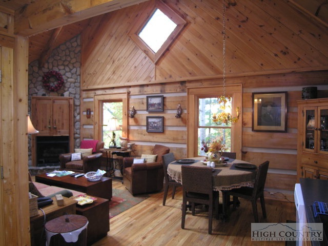 236 Frog Hollar Road Deep Gap, NC 28618 - Photo 8 of 23 a view of a dining room with furniture window and outside view