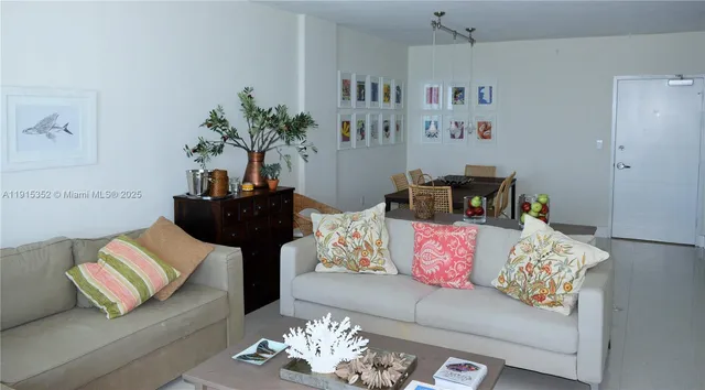 a living room with furniture flowerpot and window
