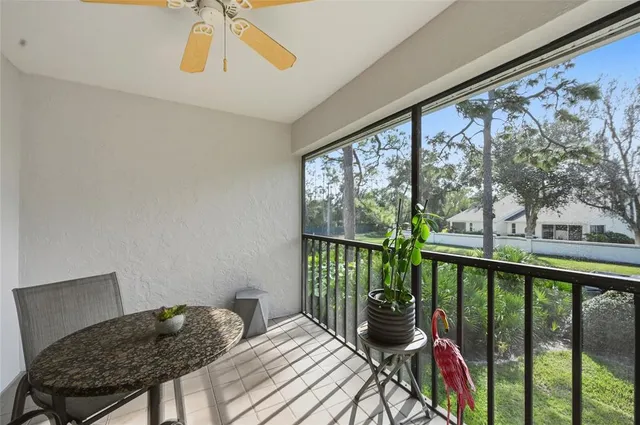 a bedroom with a bed and a view of balcony