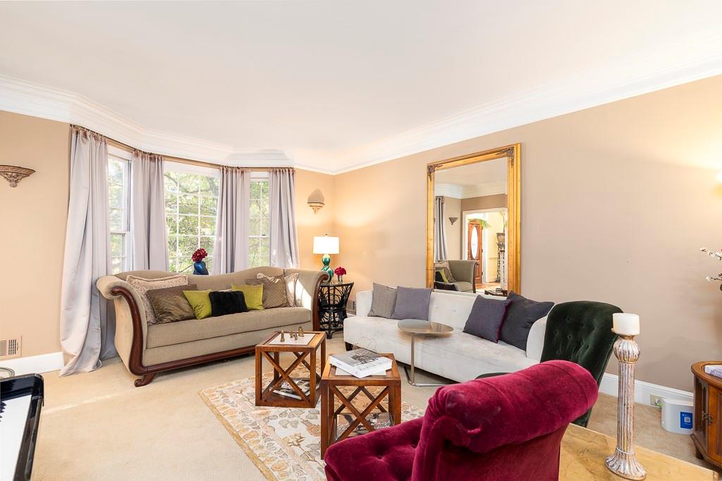 135 Lazy Laurel Chase Roswell, GA 30076 - Photo 13 of 64 a living room with furniture and a large window