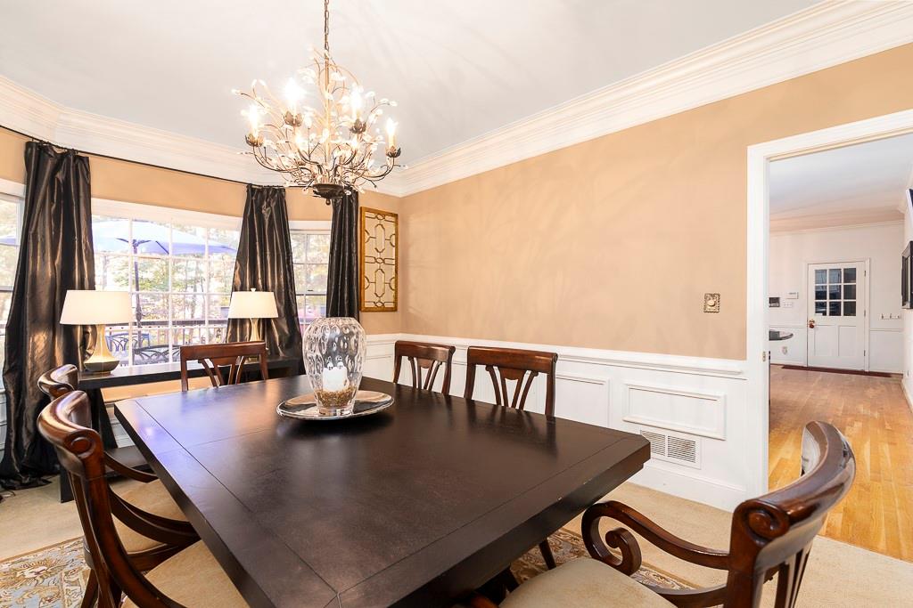 135 Lazy Laurel Chase Roswell, GA 30076 - Photo 19 of 64 a dining room with furniture and window
