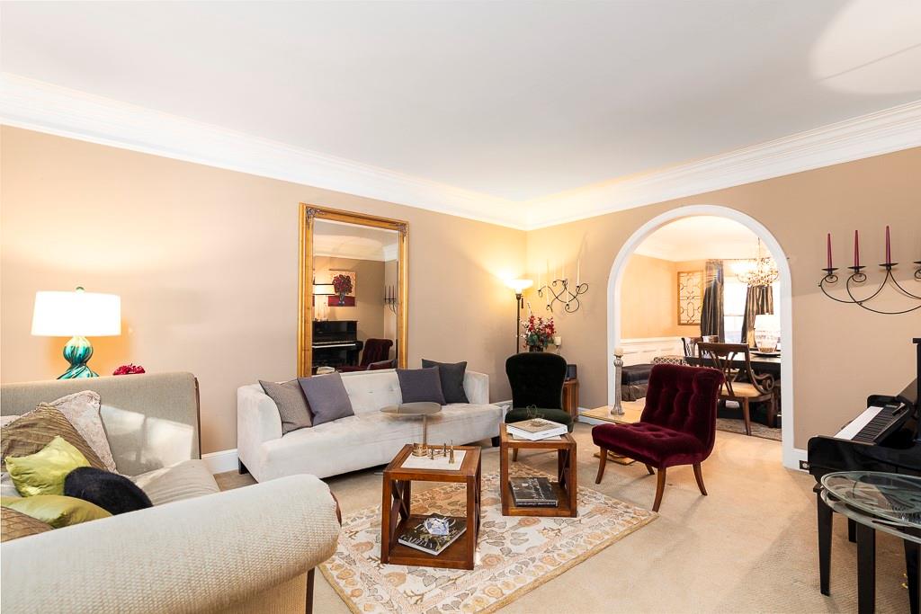 135 Lazy Laurel Chase Roswell, GA 30076 - Photo 3 of 64 a living room with furniture a rug a lamp and a large window