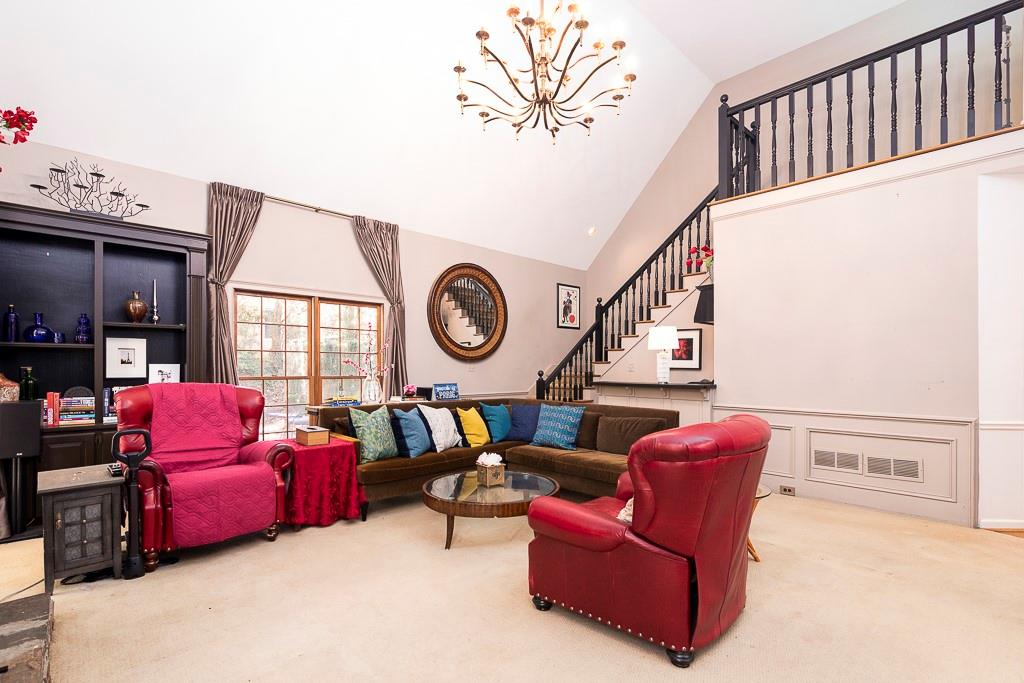 135 Lazy Laurel Chase Roswell, GA 30076 - Photo 31 of 64 a living room with furniture a rug and a window