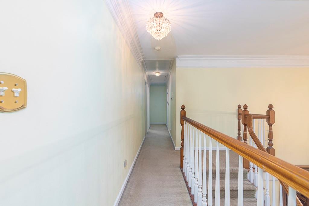 135 Lazy Laurel Chase Roswell, GA 30076 - Photo 40 of 64 a view of a hallway with windows
