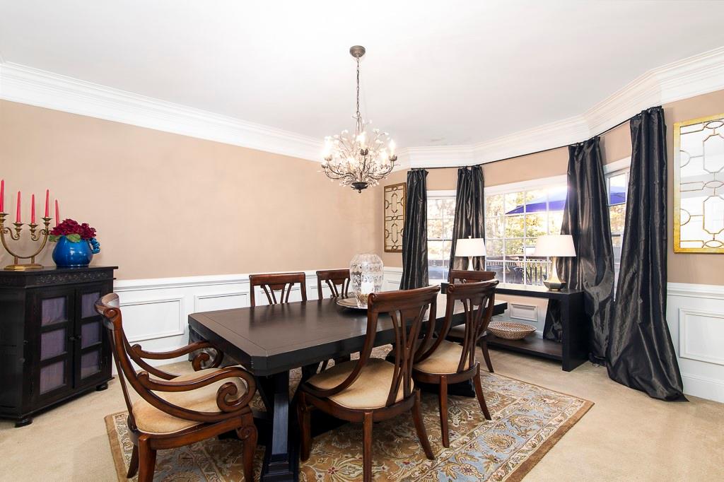 135 Lazy Laurel Chase Roswell, GA 30076 - Photo 4 of 64 a view of a dining room with furniture and window
